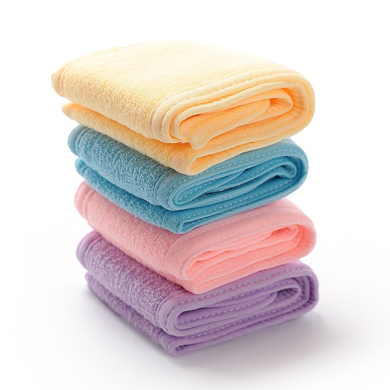 Stack of colorful soft towels in yellow blue pink and purple for beauty headbands for women