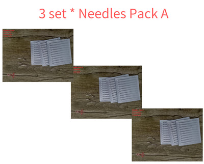 Three sets of needle packs for blue light acne device laid out on wooden surface
