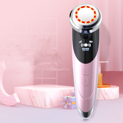 Pink and silver electric facial cleansing brush with LED light and digital display for deep skin care