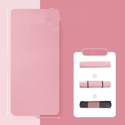 Pink fitness mat for home workouts rolled and unrolled with carrying strap and bag