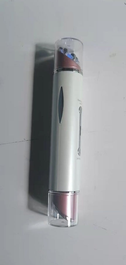 White and pink handheld heated eye massager with clear protective caps on both ends
