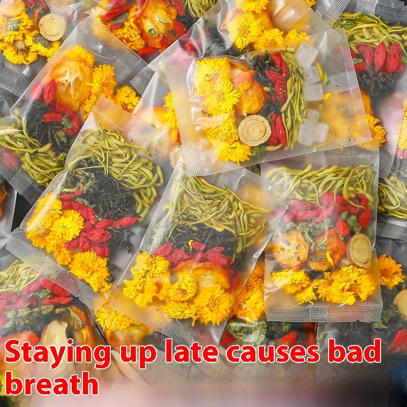 Packets of honeysuckle chrysanthemum tea with dried flowers and herbs in clear packaging