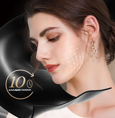 Woman using a black LED light therapy mask with facial grid illumination for skincare treatment