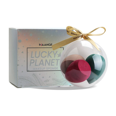 Spherical makeup sponge set in clear ornament ball with gold ribbon and decorative box packaging