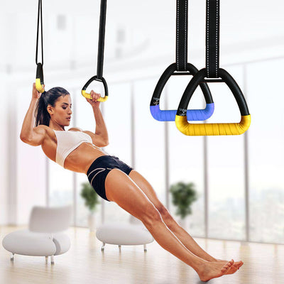 Woman using ring fitness equipment for home workouts, performing bodyweight exercises in a bright room