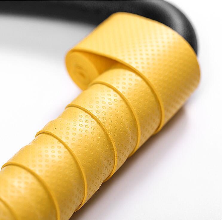 Close-up of yellow textured grip on ring fitness equipment for home use