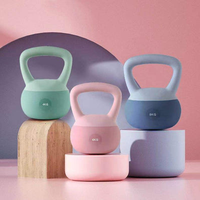 Set of pastel colored women's kettlebell for home workouts in 4kg, 6kg, and 8kg weights on display