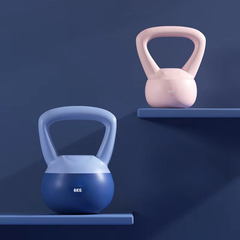 Blue and pink women's kettlebell for home workouts with ergonomic handles displayed on shelves