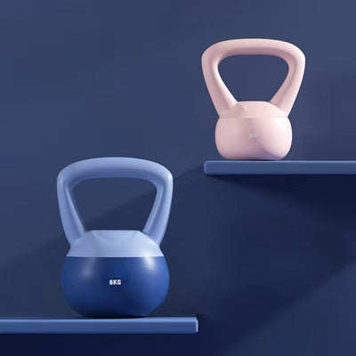 Blue and pink women's kettlebell for home workouts with ergonomic handles displayed on shelves